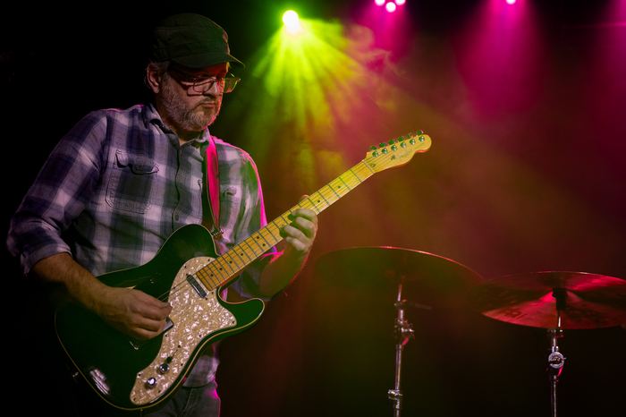 Ryan Elliott plays guitar during the band's inaugural show.