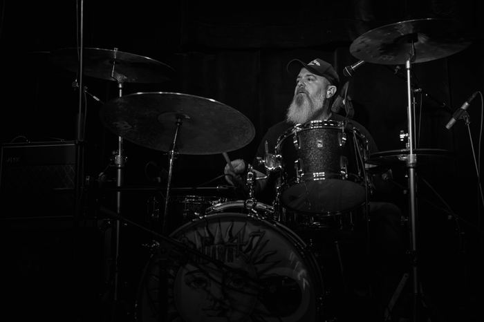 Rob Bueno plays drums.