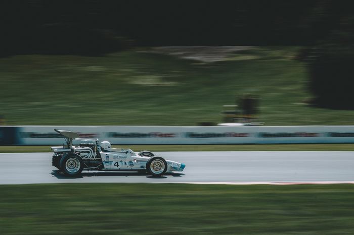 A 1969 McKee Mk 12c accelerates out of turn 7 in Friday practice.
