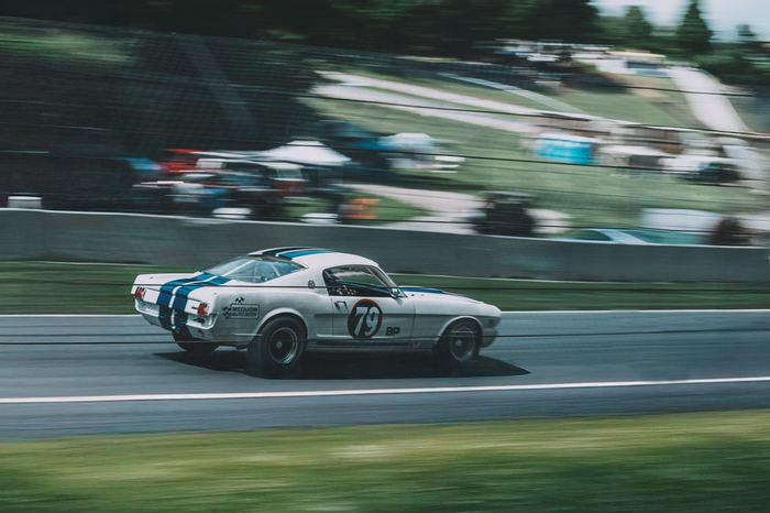 A 1965 Shelby GT350 approaches turn 5.