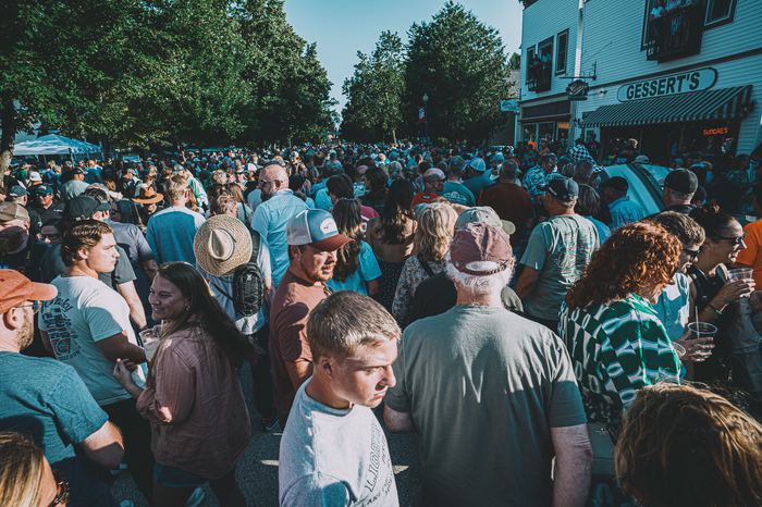 A huge crowd fills the streets of Elkhart Lake for the race car parade on Friday night.